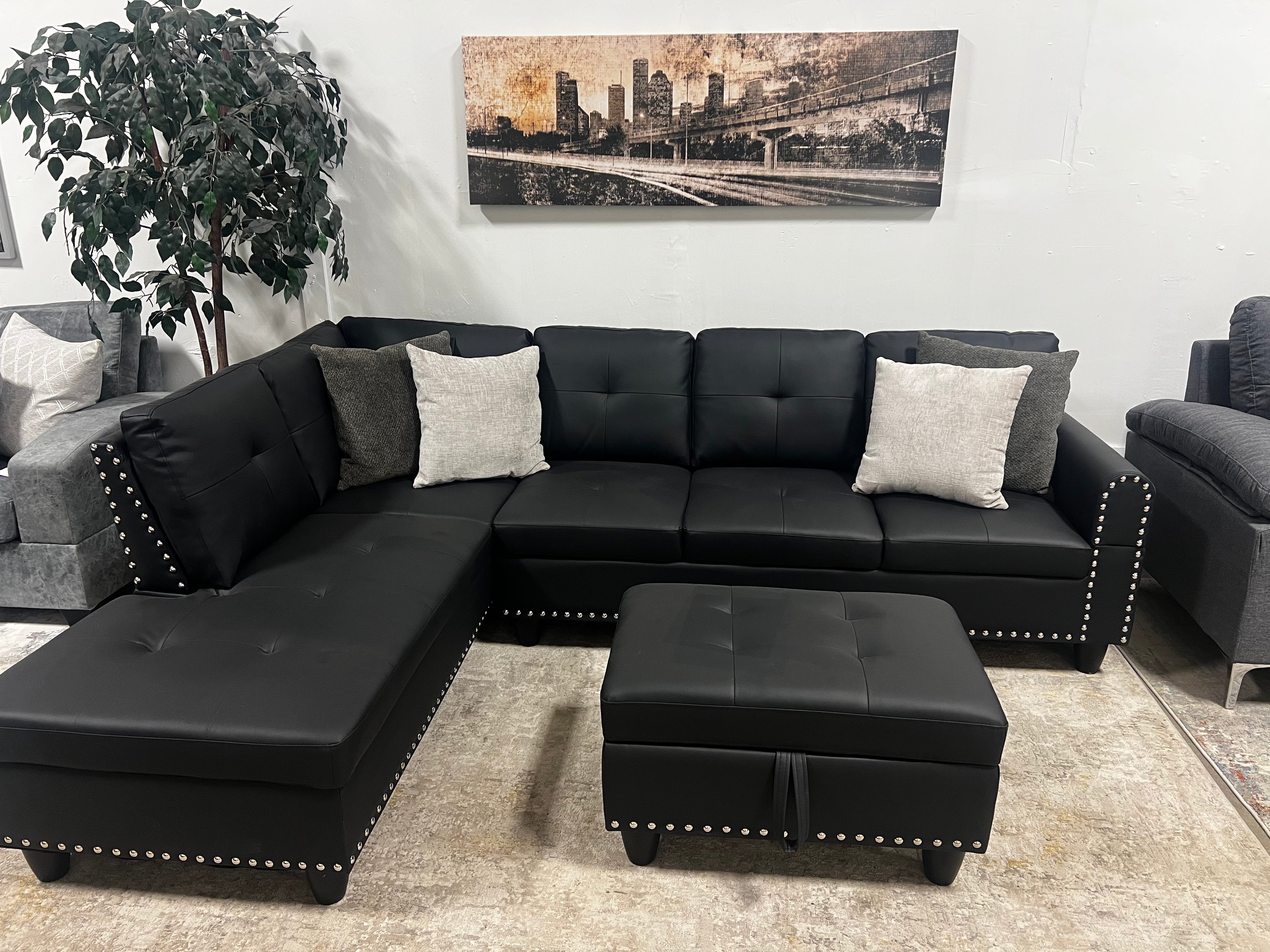 Faux Leather Sectional with Pull-Out Cupholders & Storage Ottoman