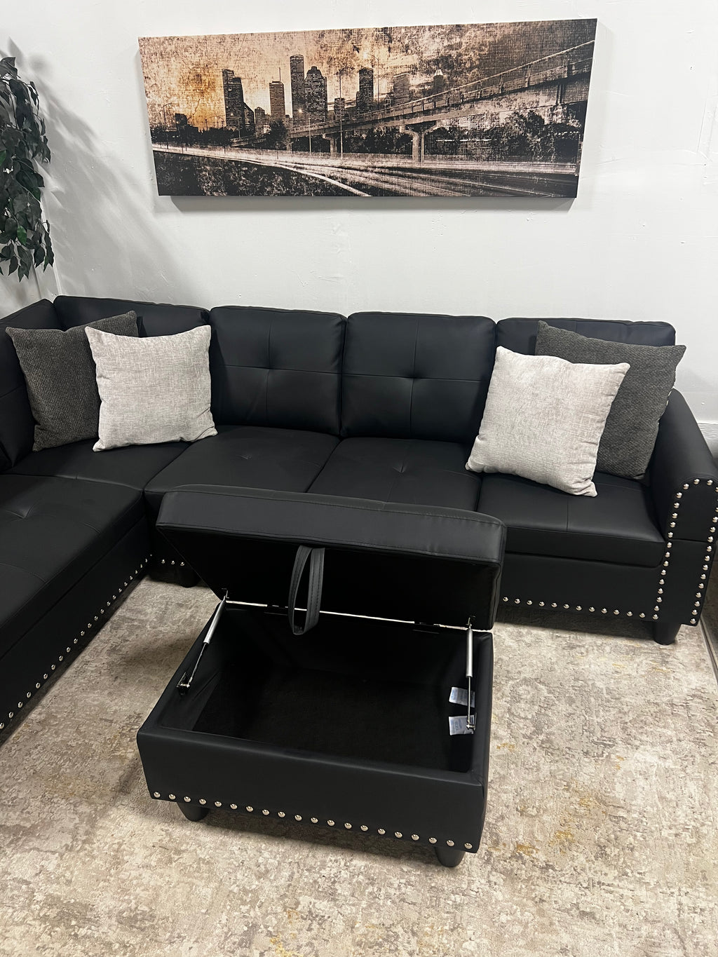 Faux Leather Sectional with Pull-Out Cupholders & Storage Ottoman