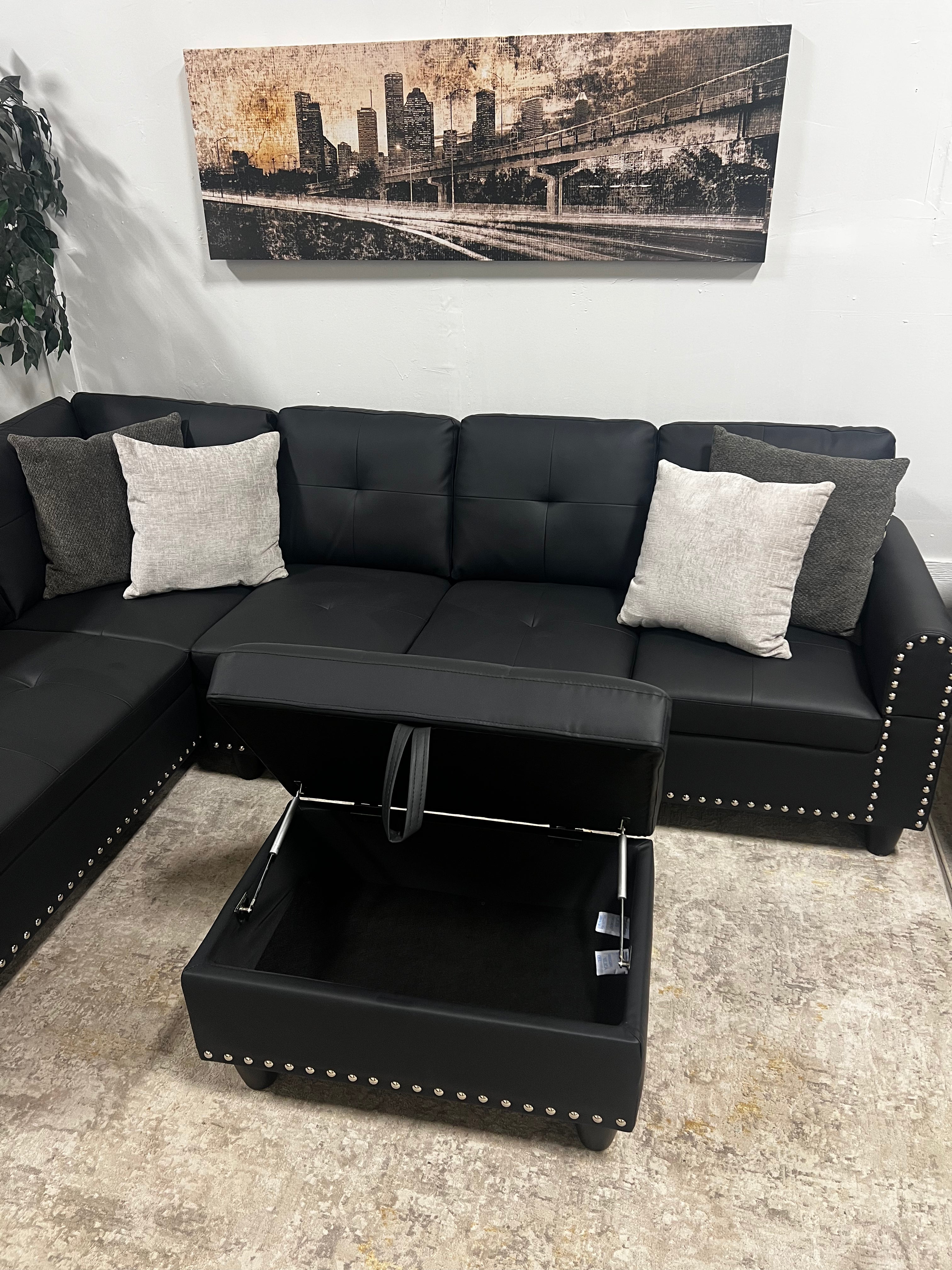 Faux Leather Sectional with Pull-Out Cupholders & Storage Ottoman