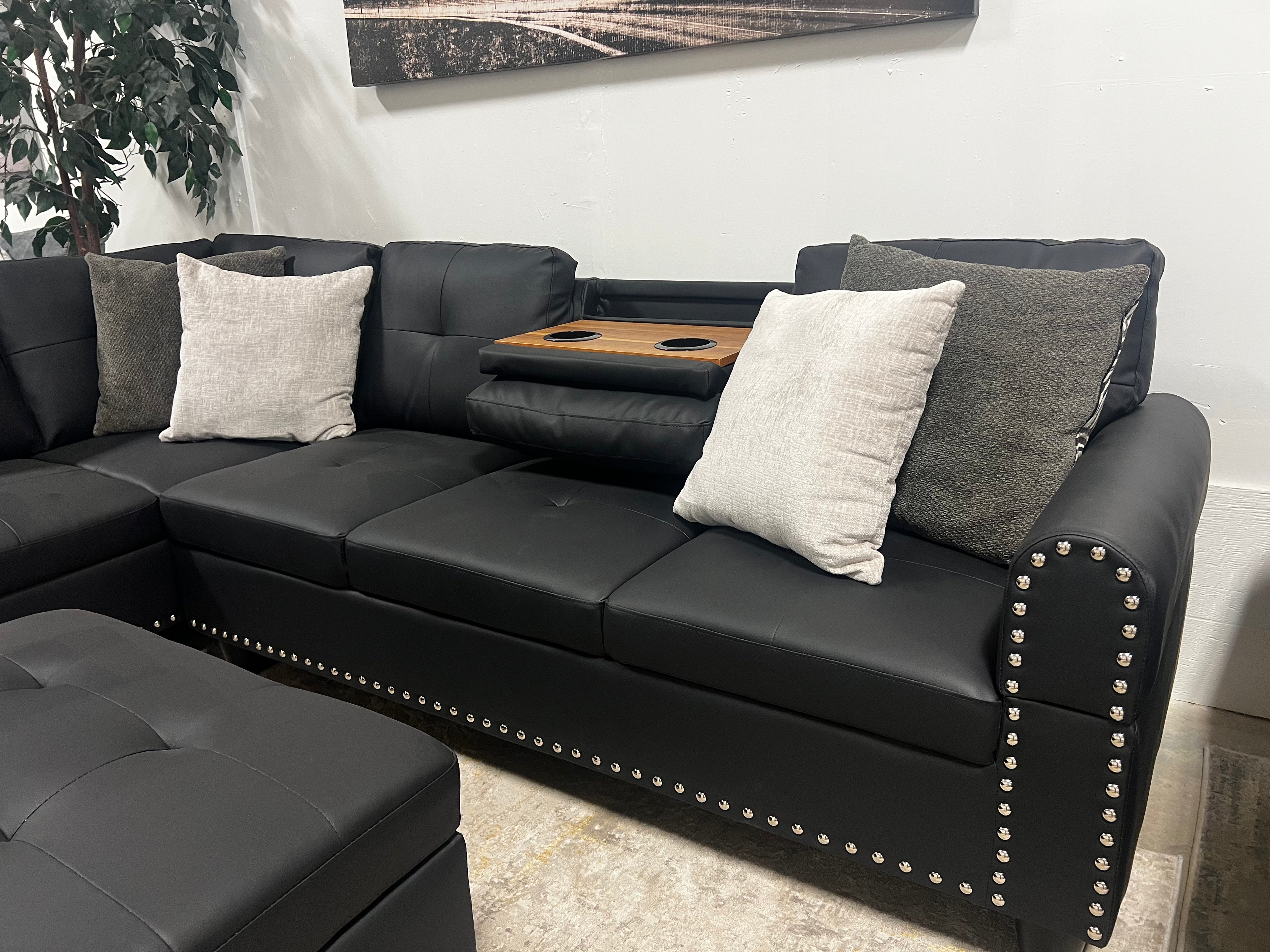 Faux Leather Sectional with Pull-Out Cupholders & Storage Ottoman