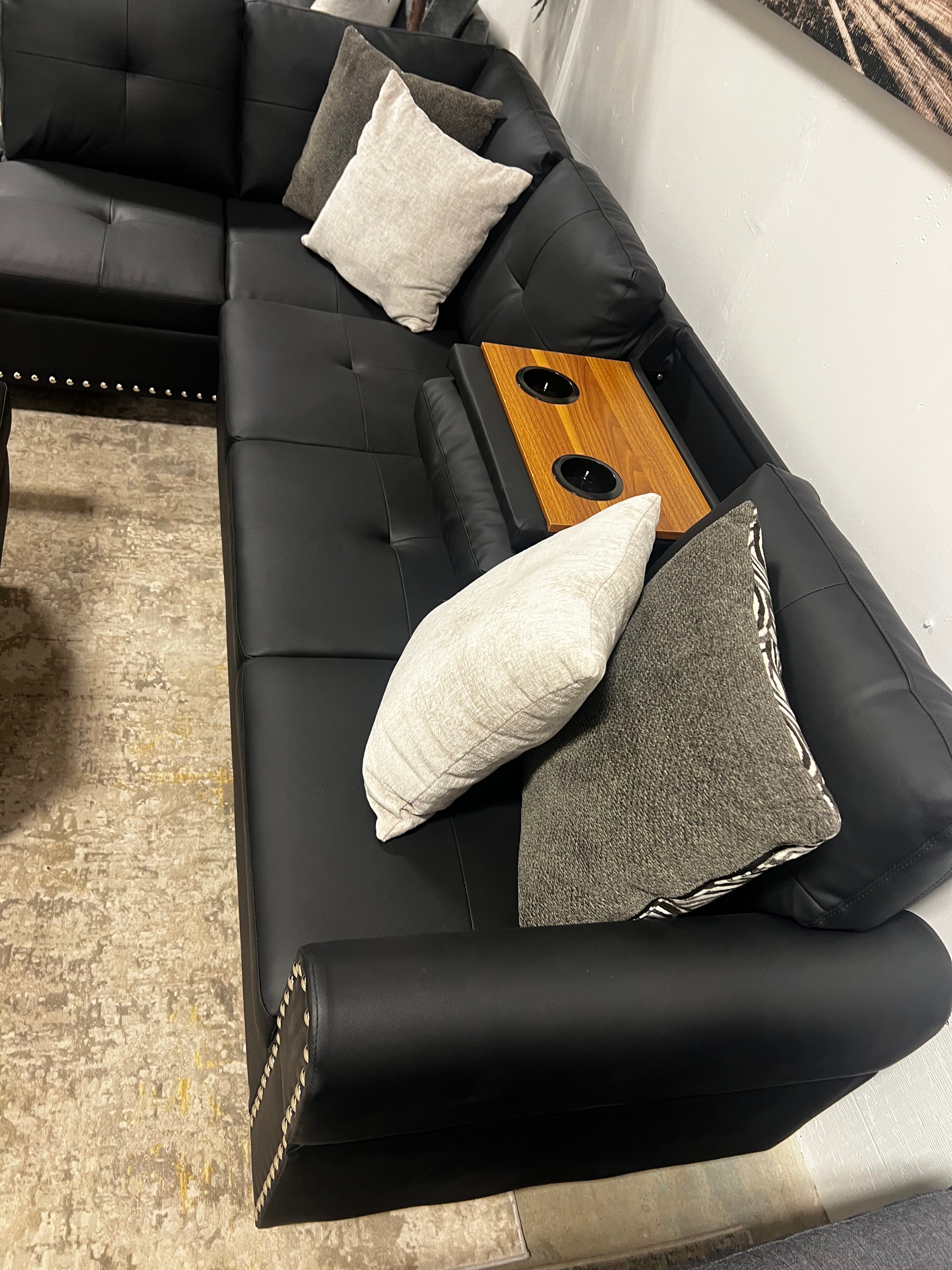 Faux Leather Sectional with Pull-Out Cupholders & Storage Ottoman