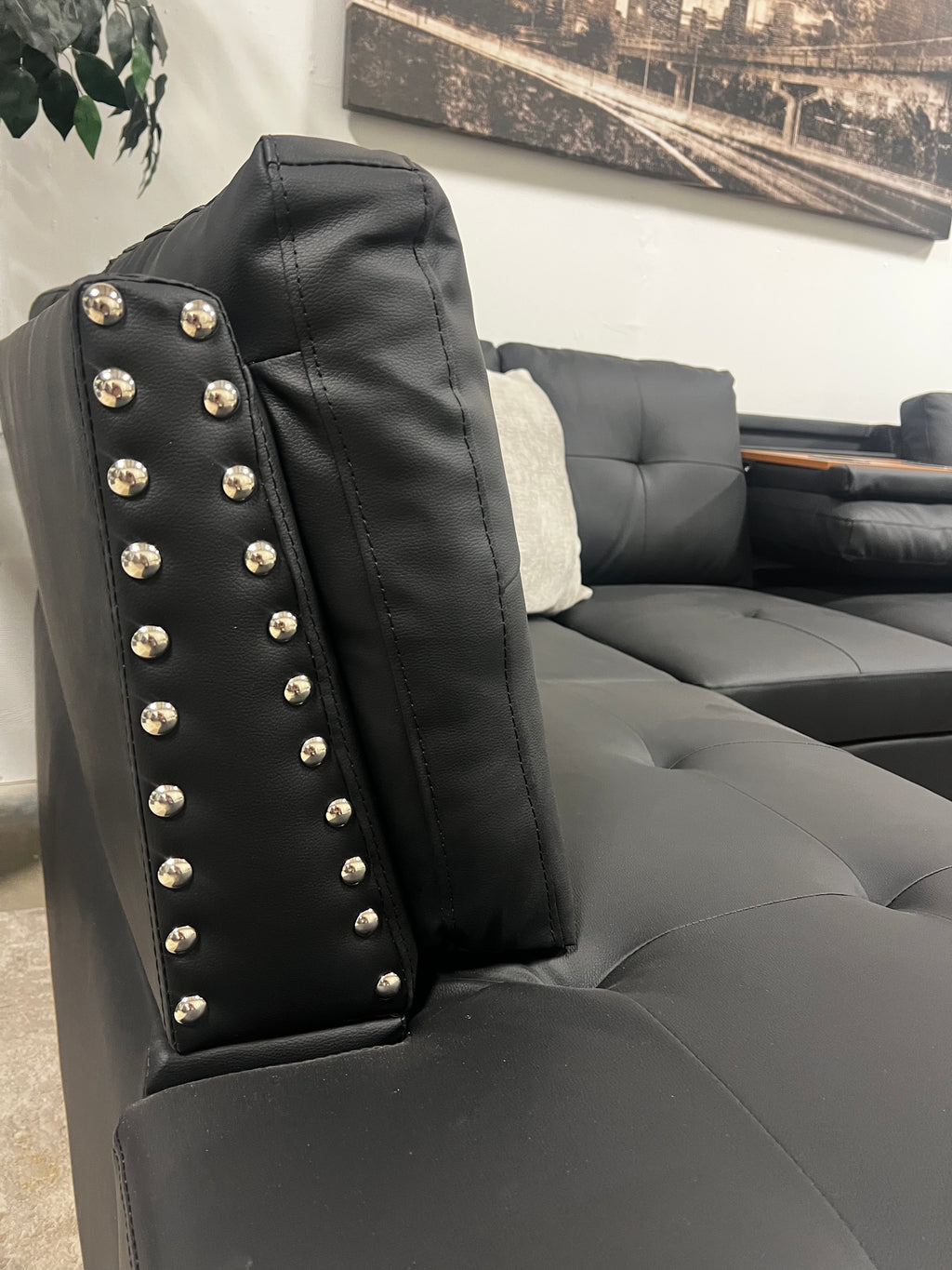 Faux Leather Sectional with Pull-Out Cupholders & Storage Ottoman